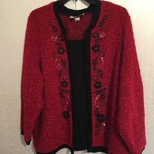Red  sweater with black trim and a few sparkles